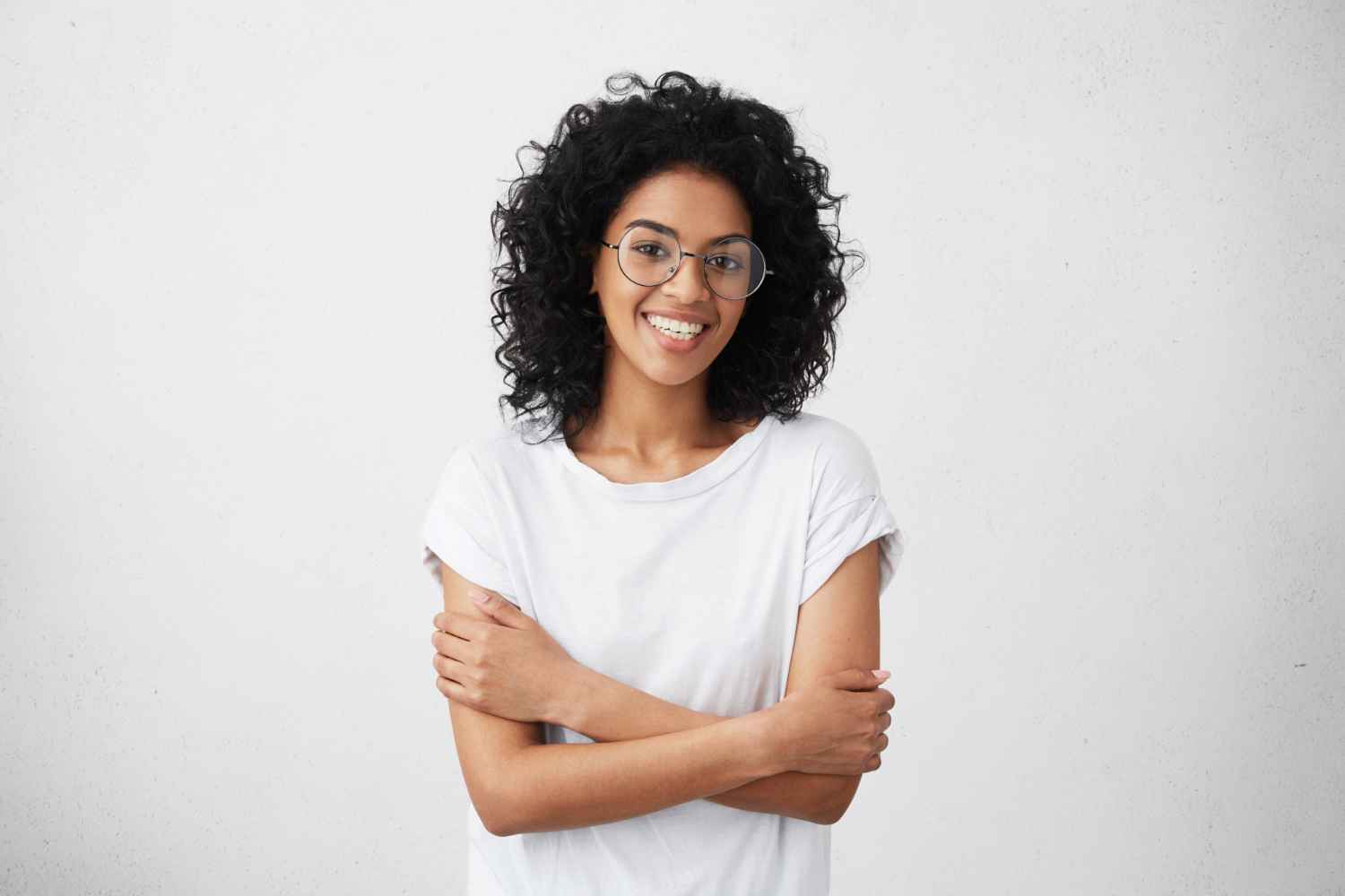 indoor-shot-beautiful-happy-african-american-woman-smiling-cheerfully-keeping-her-arms-folded-relaxing-indoors-after-morning-lectures-university_11zon
